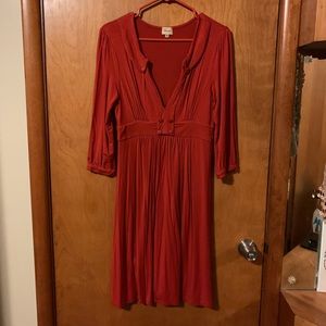 Vintage style burnt orange dress.